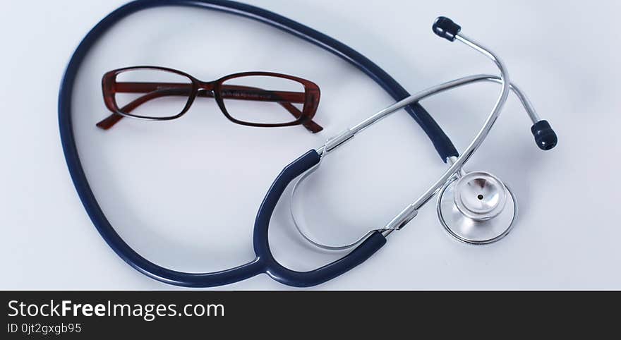 Stethoscope on cardiogram concept for heart care on the desk.blue toned images.