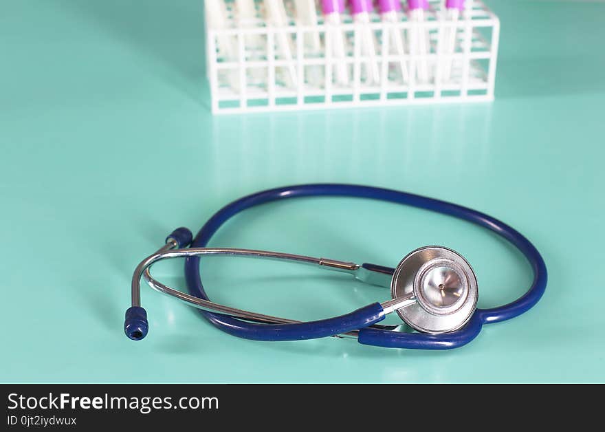 Doctor`s workspace working table with patient`s discharge blank paper form, medical prescription, stethoscope on desk