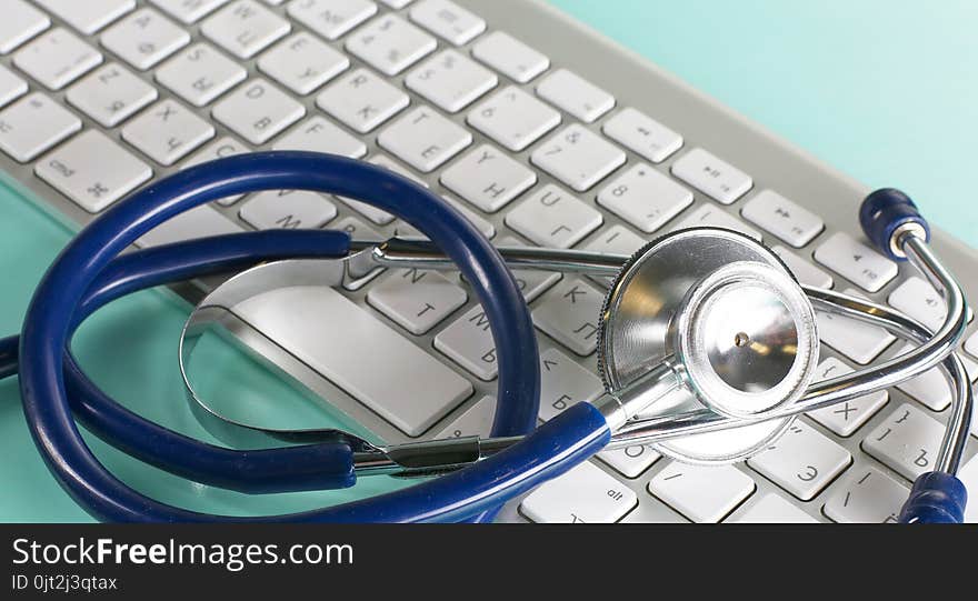 A Stethoscope Is On The Keyboard Of A Computer