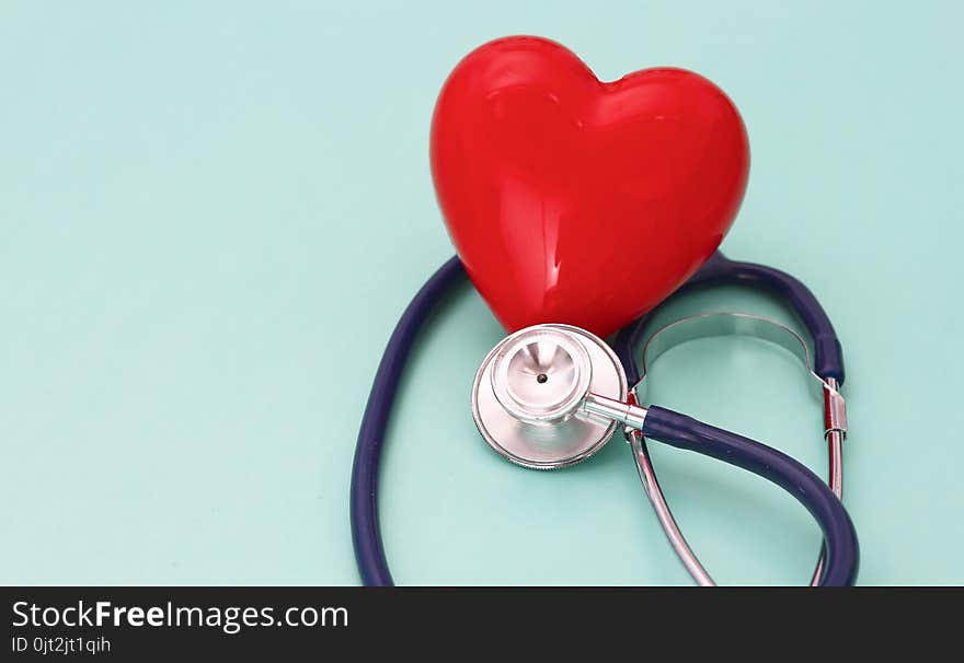 Red Heart With Stethoscope On Blue Wooden Background. Copy Space. Valentines Day.