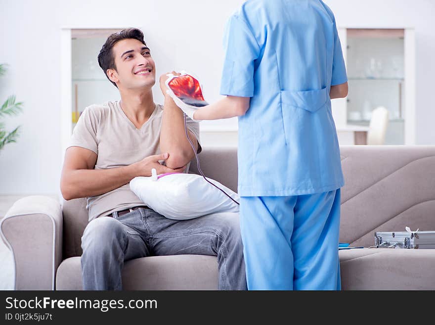 The patient getting blood transfusion in hospital clinic