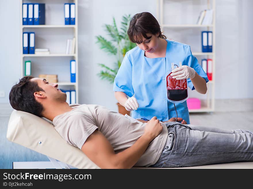 The patient getting blood transfusion in hospital clinic