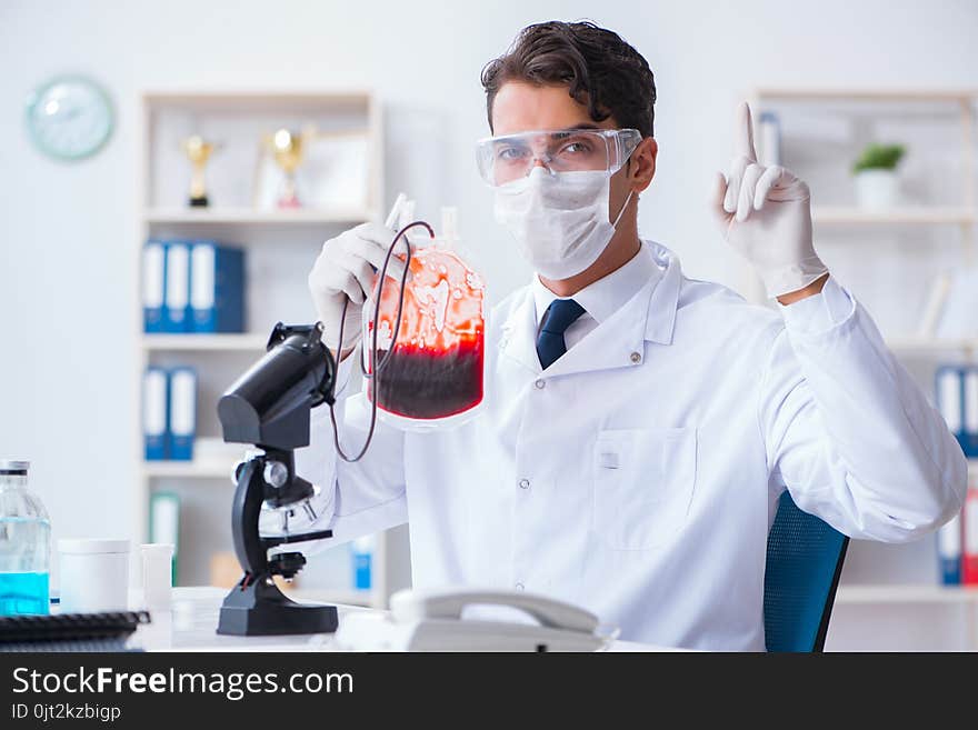 The Doctor Working With Blood Samples In Hospital Clinic Lab