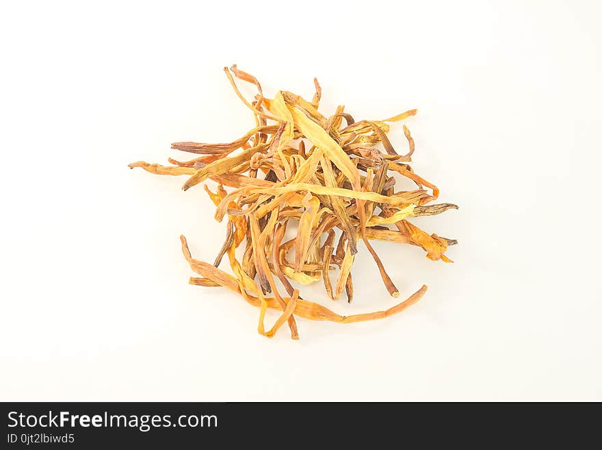 Dried daylily was placed on a white background.