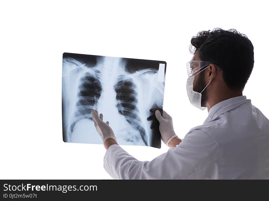 The young doctor looking at x-ray images isolated on white