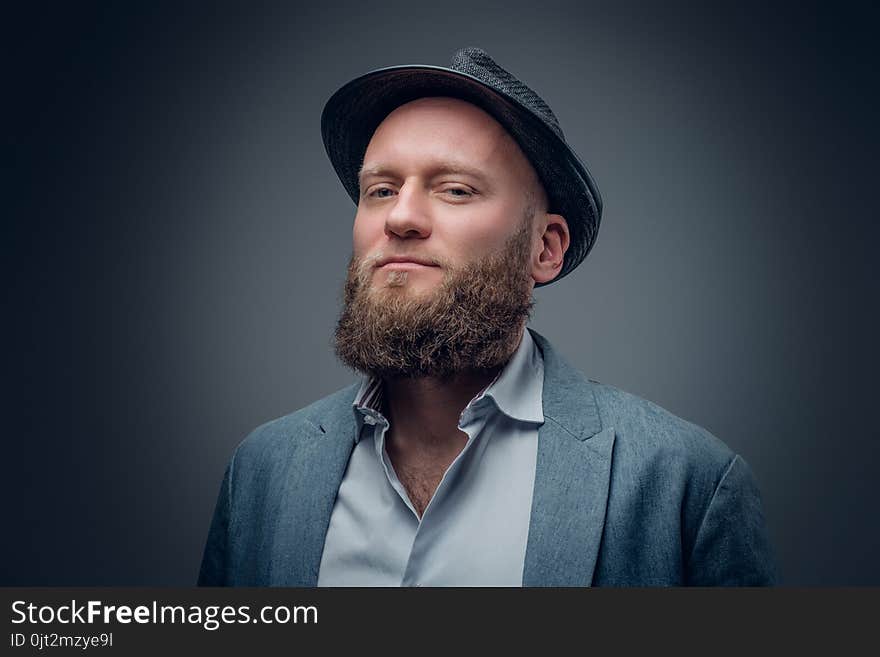 Close up portrait of bearded male in a felt hat.