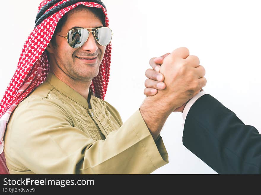 Arab businessman and businessman worker handshaking, man