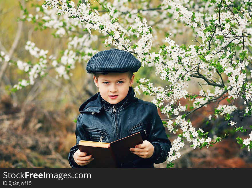 Boy on a walk in the garden in the spring