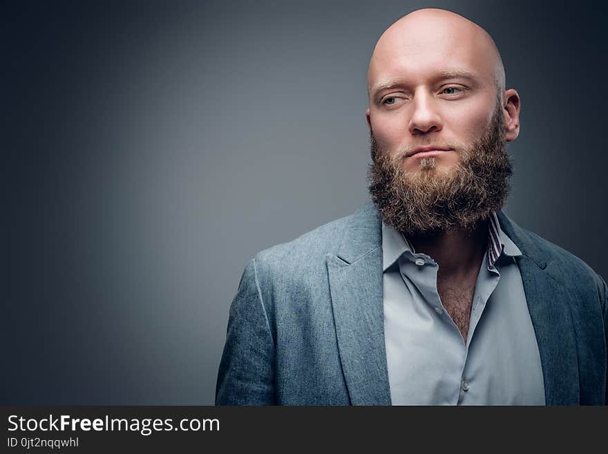 Hairless Male In A Suit On Grey Vignette Background.