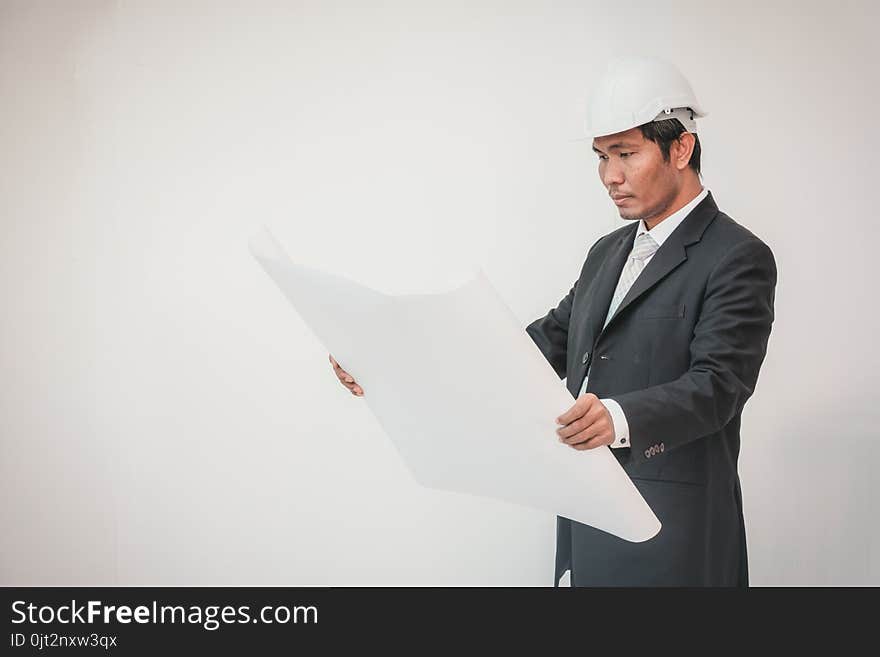 Businessman planning construction project, man