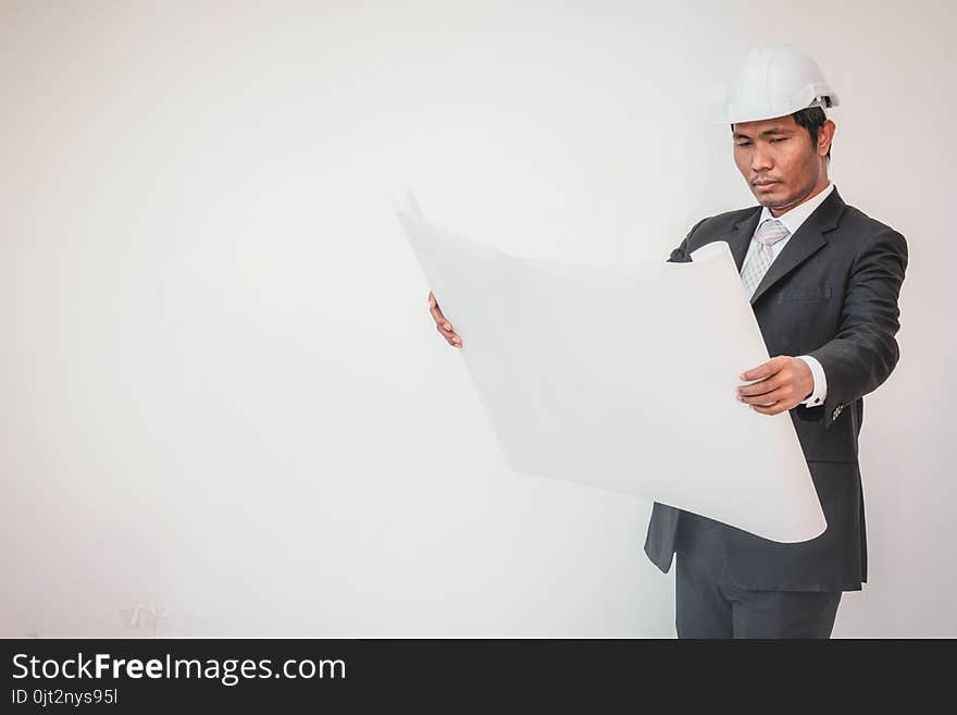 Businessman planning construction project, man