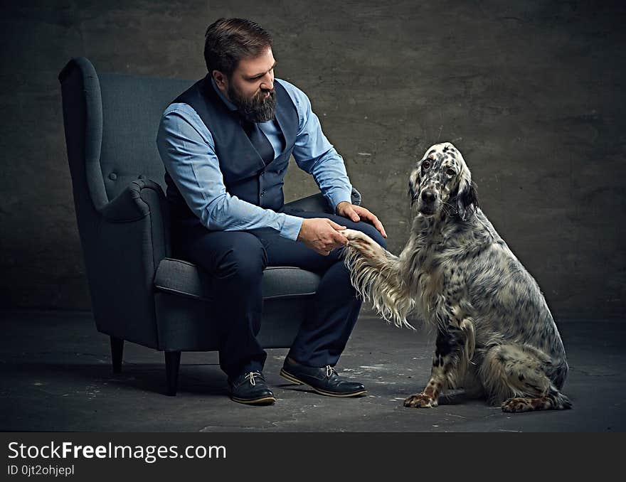 Stylish bearded middle age male and Irish setter. Stylish bearded middle age male and Irish setter.