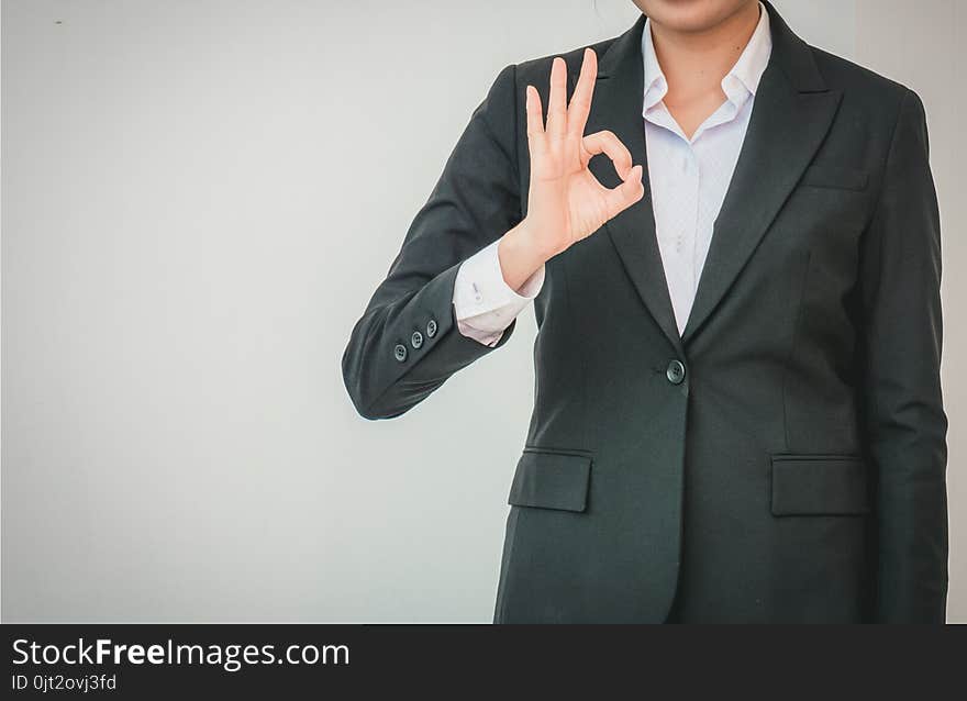 Businesswoman Pointing Up Ok Hand Sign