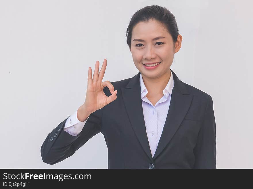 businesswoman pointing up ok hand sign, woman