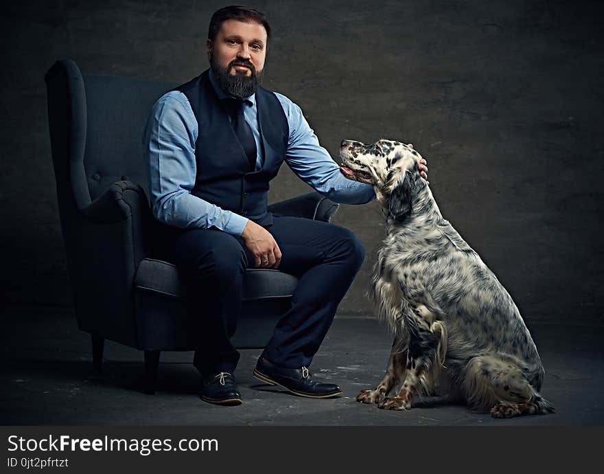 A man and Irish setter dog.