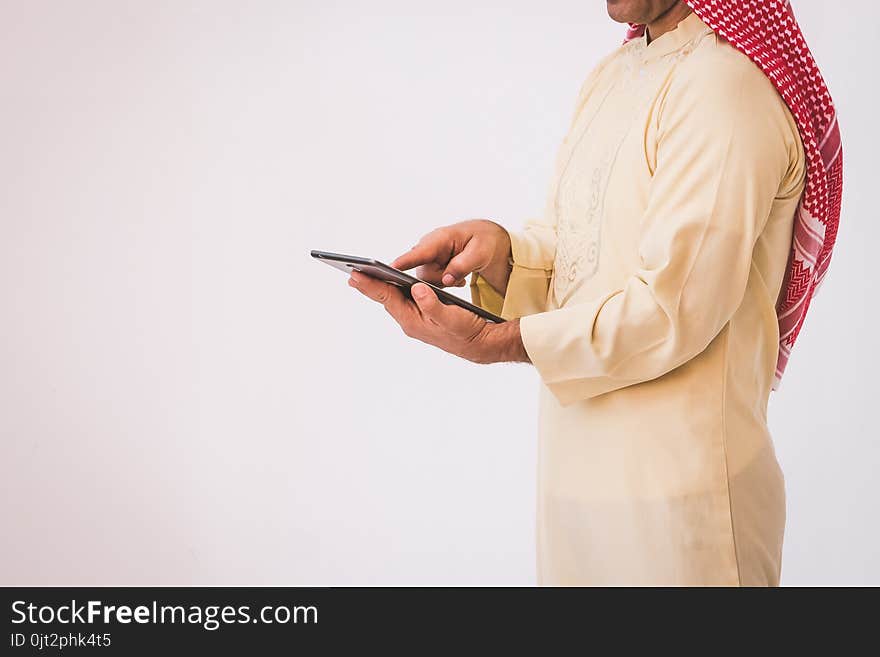 Arab businessman useing on a mobile phone, man