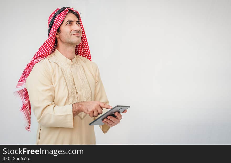 Arab businessman useing on a mobile phone.