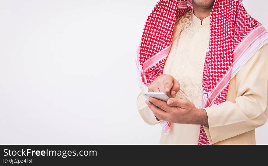 Arab businessman useing on a mobile phone.