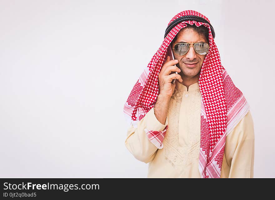 Arab businessman useing on a mobile phone.