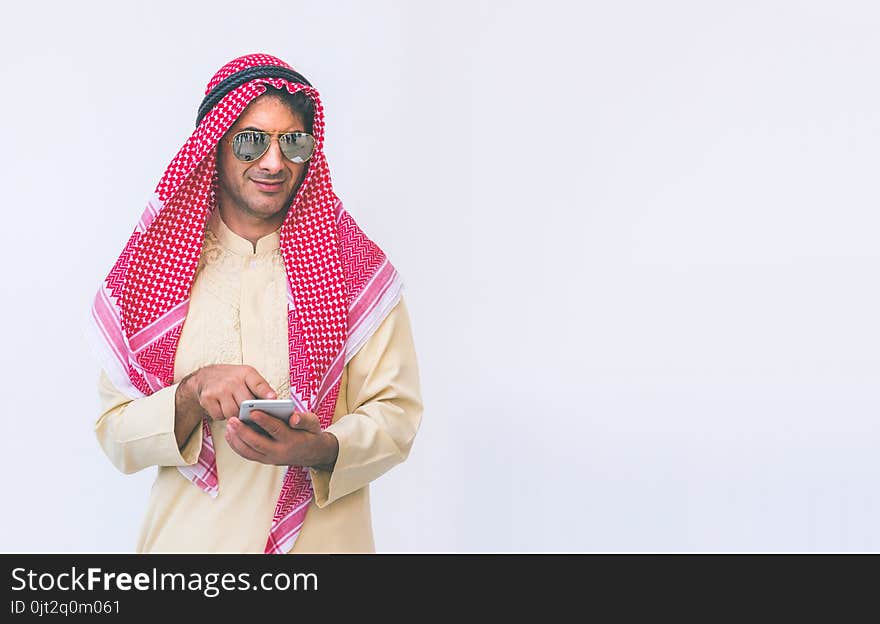 Arab businessman useing on a mobile phone, man