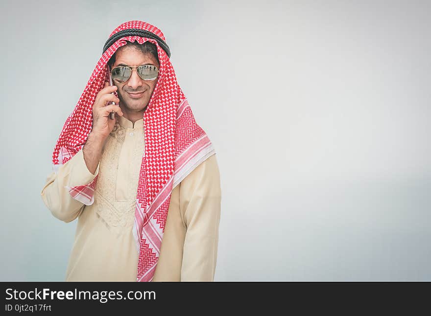 Arab businessman useing on a mobile phone.