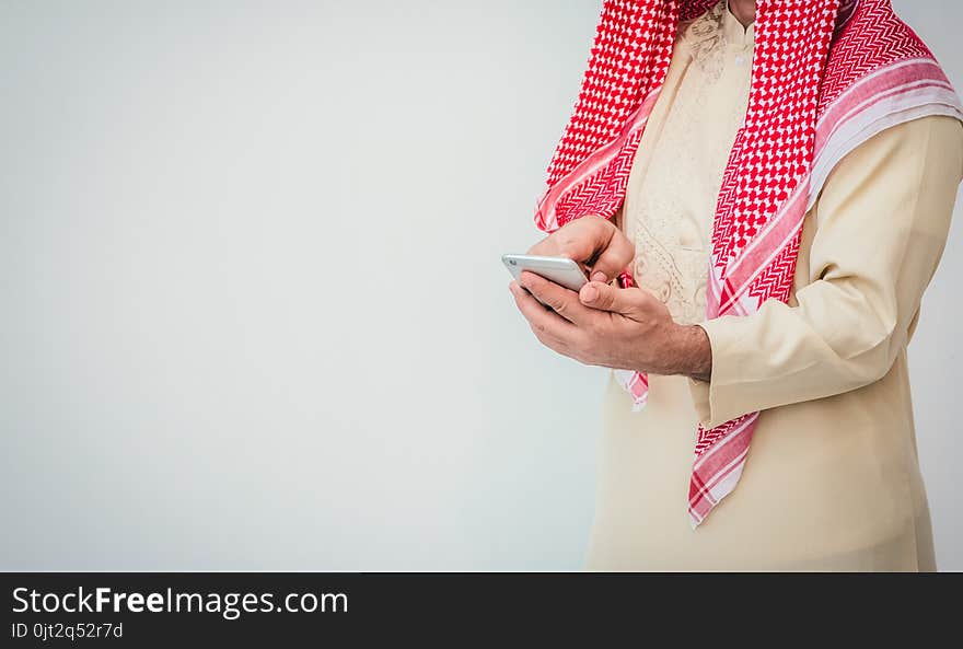 Arab businessman useing on a mobile phone.