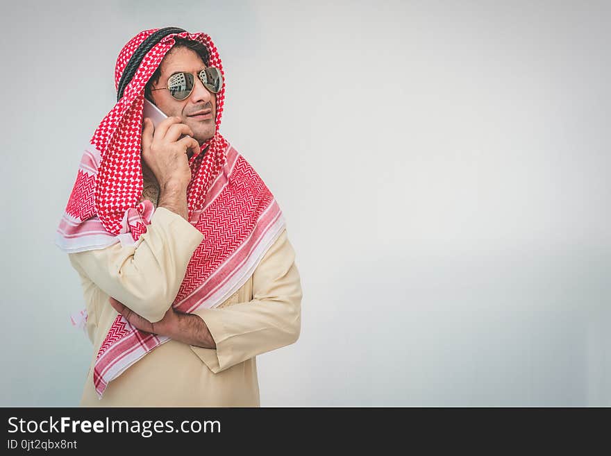 Arab businessman useing on a mobile phone