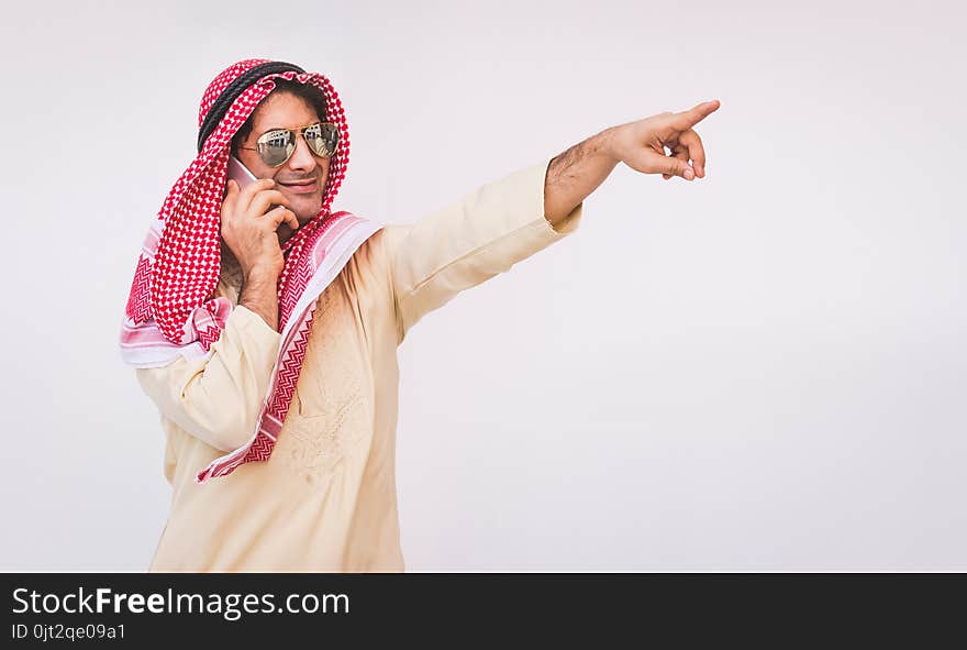 Arab businessman useing on a mobile phone.