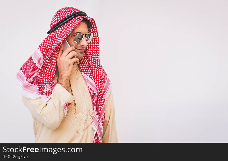 Arab businessman useing on a mobile phone, man