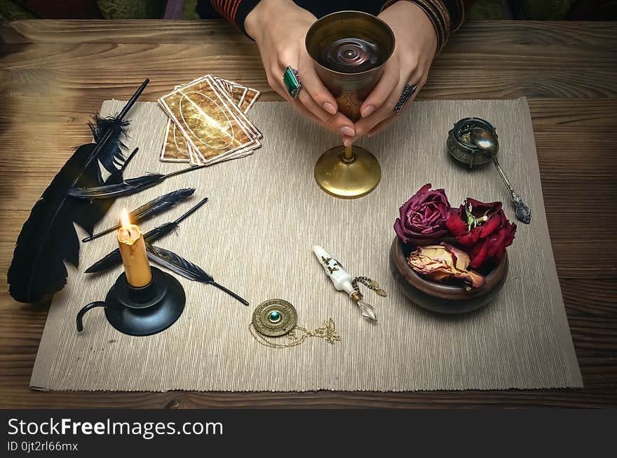 Woman witch prepare a magic potion. Tarot cards. Future reading. Fortune teller concept.