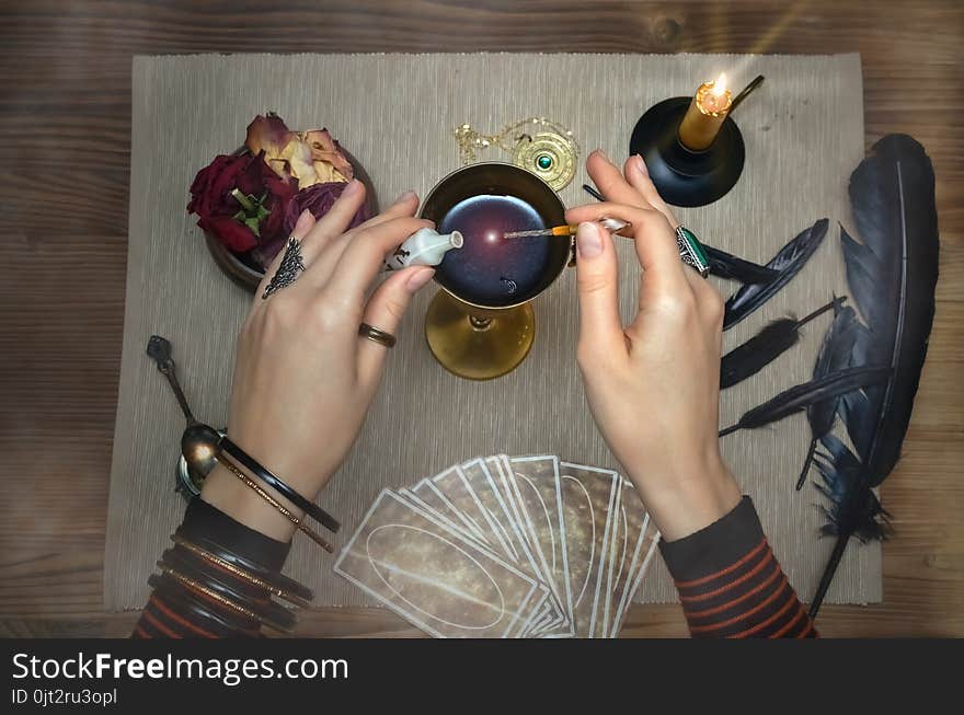 Magic potion. Tarot cards on fortune teller desk table. Future reading. Magic potion. Tarot cards on fortune teller desk table. Future reading.