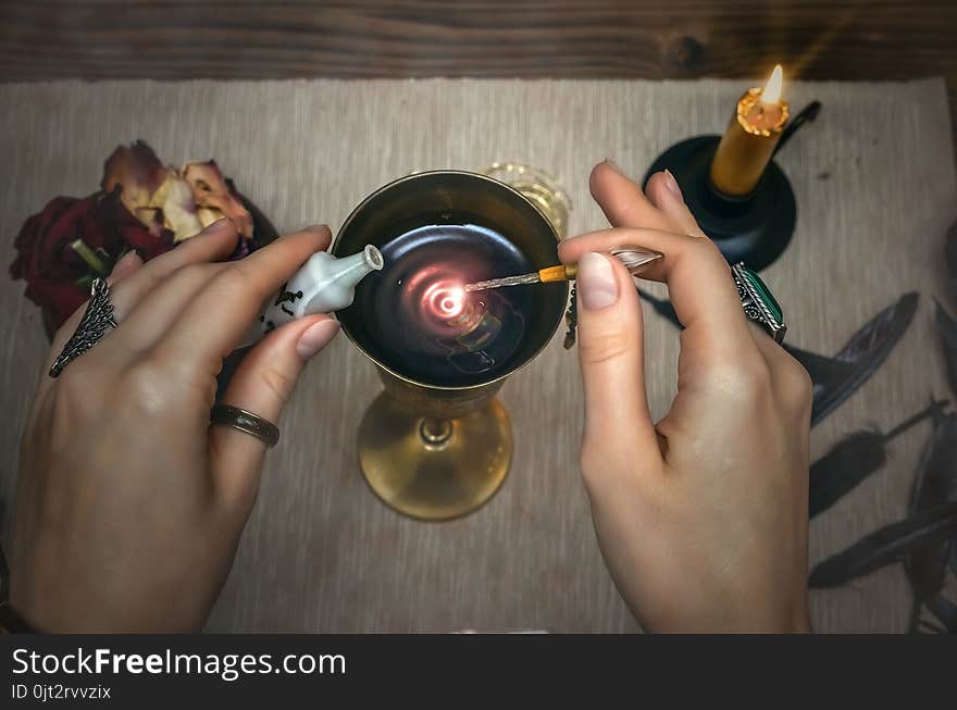 Woman witch prepare a magic potion. Tarot cards. Future reading. Fortune teller concept.