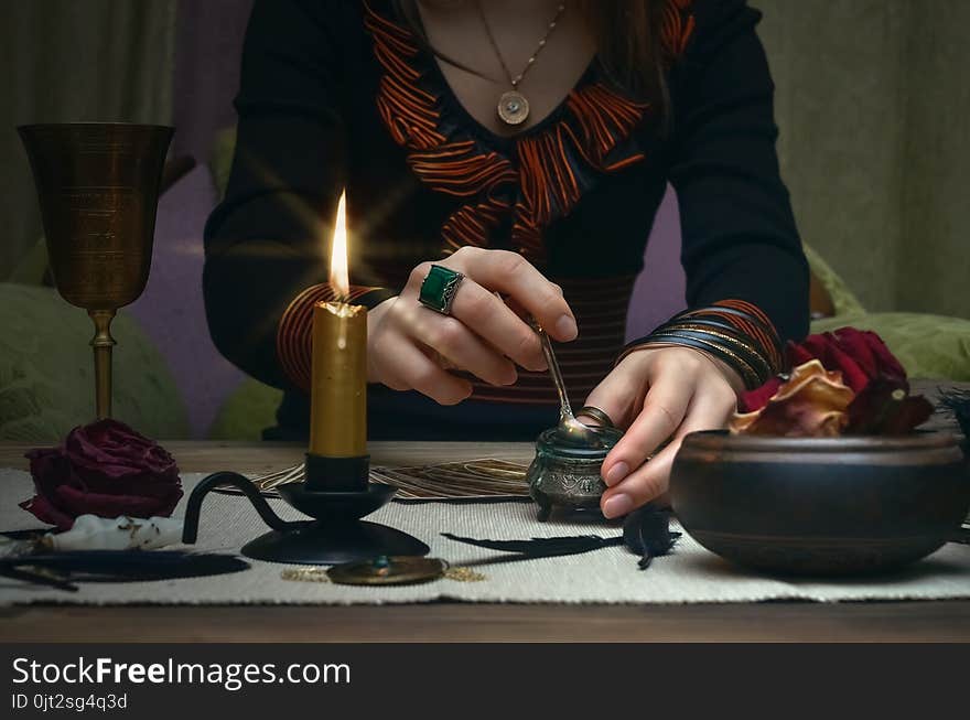 Woman witch prepare a magic potion. Tarot cards. Future reading. Fortune teller concept.