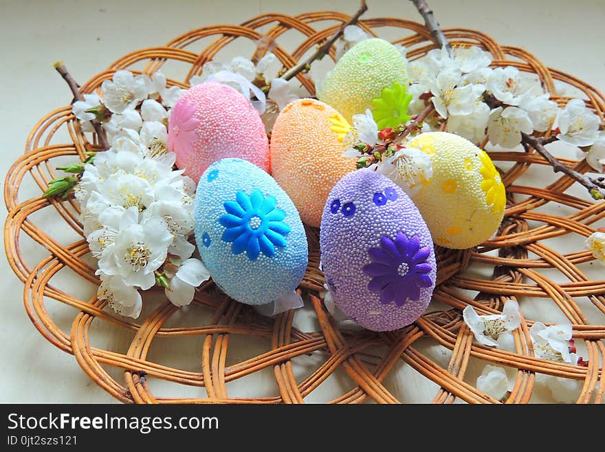 Painted Easter eggs basket and cherry tree blossom. Painted Easter eggs basket and cherry tree blossom