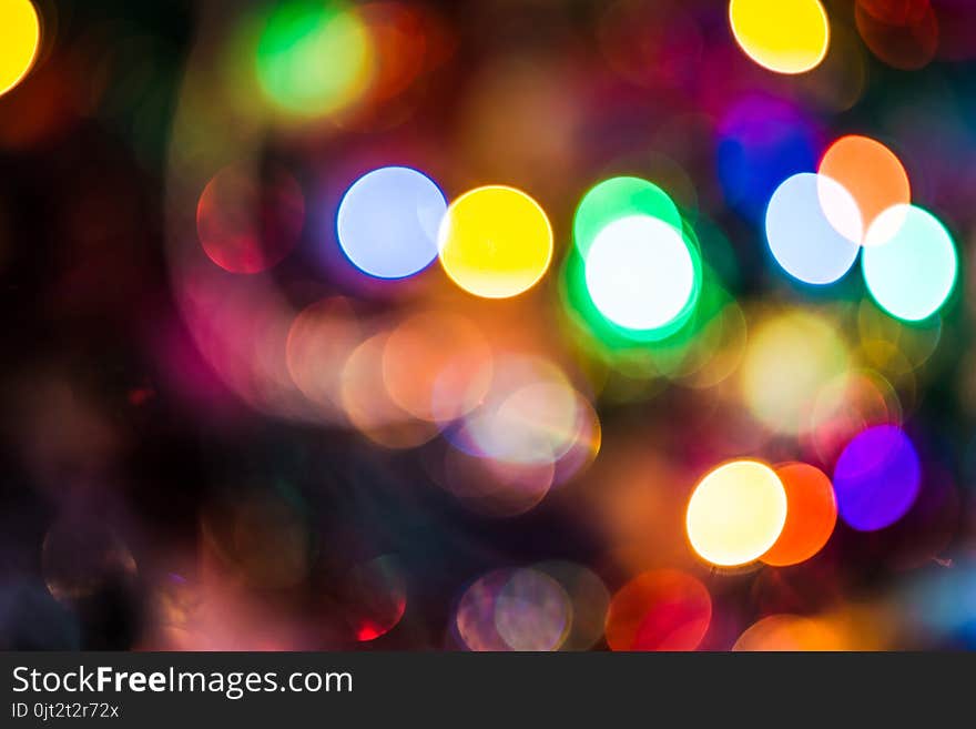 Decorated Christmas tree and colorful garland lights, defocused background, bokeh effect. Decorated Christmas tree and colorful garland lights, defocused background, bokeh effect.