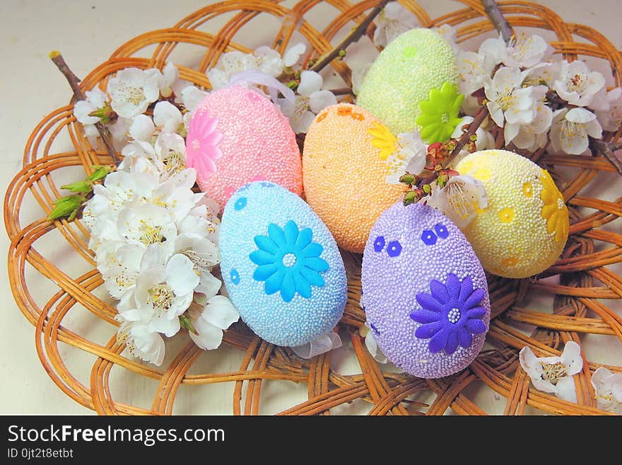 Painted Easter eggs basket and cherry tree blossom. Painted Easter eggs basket and cherry tree blossom