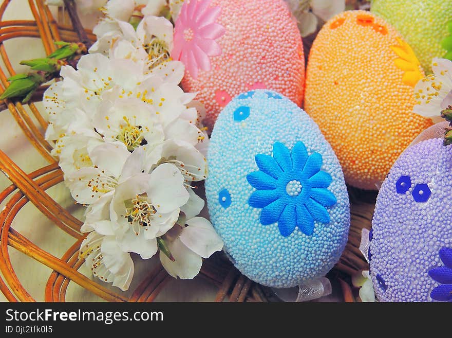 Painted Easter eggs basket and cherry tree blossom. Painted Easter eggs basket and cherry tree blossom