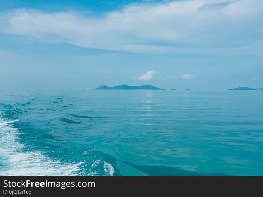 Blue sea with white clouds abstract background pattern. Blue sea with white clouds abstract background pattern