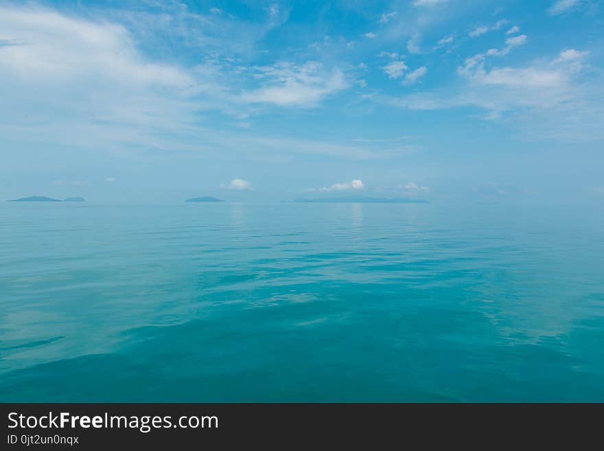 Blue sea with white clouds abstract background pattern. Blue sea with white clouds abstract background pattern