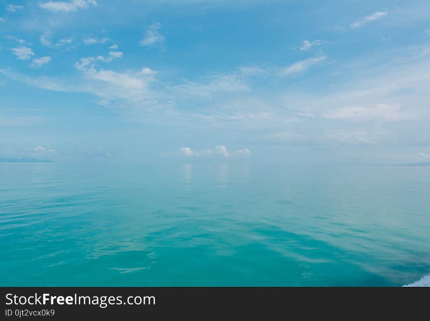 Blue sea with white clouds abstract background pattern. Blue sea with white clouds abstract background pattern