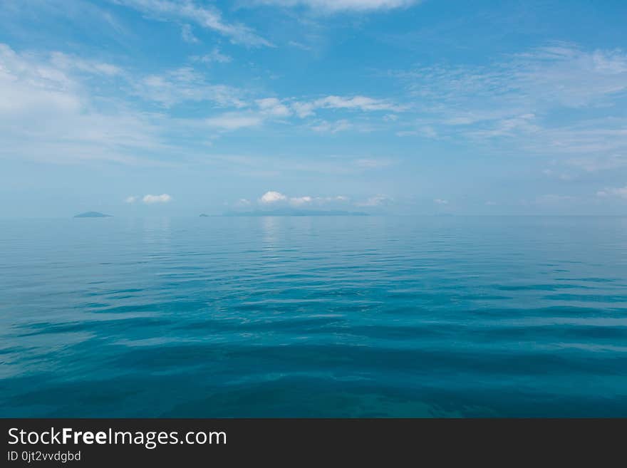 Blue sea with white clouds abstract background pattern. Blue sea with white clouds abstract background pattern