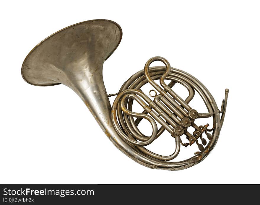 Old vintage rusty French horn on a withe background, isolated