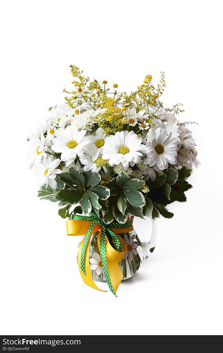 Feminine simple bouquet consisting, mimosa, chamomile in vase on white background ,delicate, summer