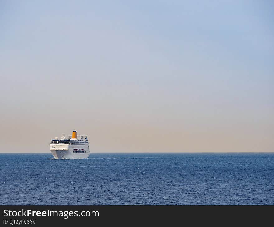 Ferryboat on the open sea at sunrise