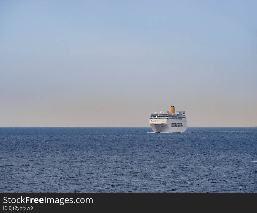 Ferryboat on the open sea at sunrise