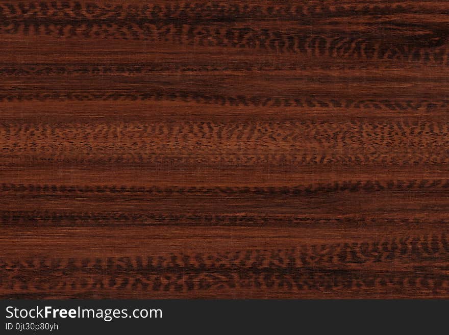 Brown wood texture. Abstract background. Dark brown scratched wooden cutting board.