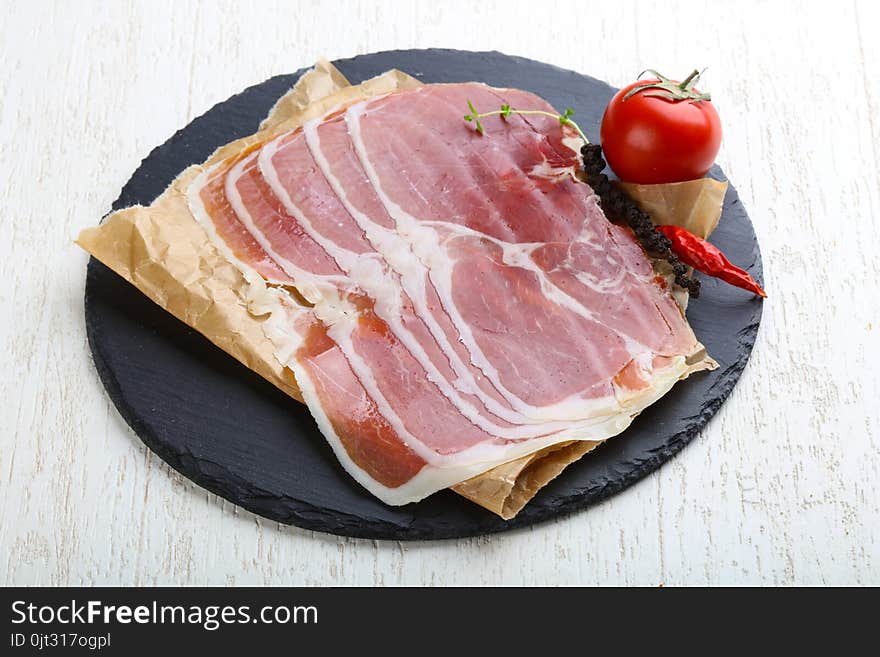 Jamon serrano with pepper and thyme leaves