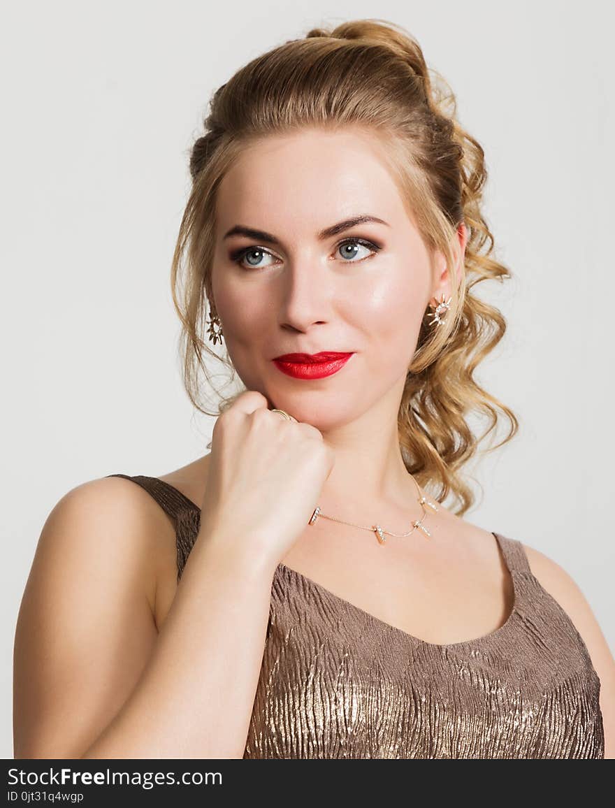 Beautiful curly woman with red lips portrait on a light background