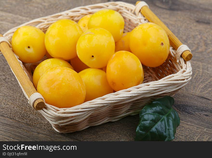 Fresh sweet ripe Yellow plums in the bowl