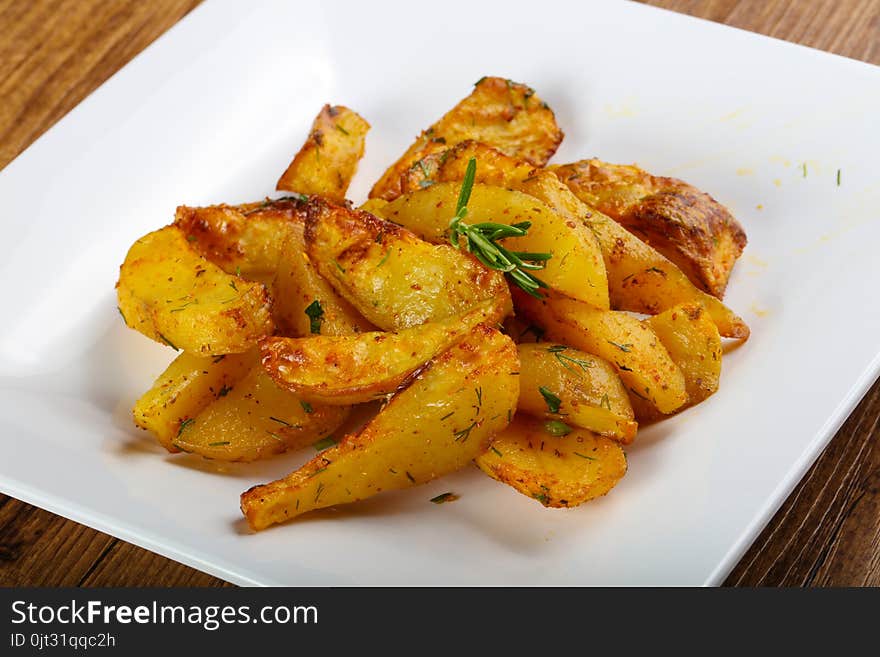 Baked potato with rosemary and parsley